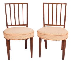 A pair of George III mahogany, line inlaid and upholstered side chairs in Sheraton taste,