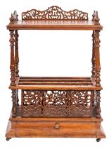 A Victorian walnut Canterbury whatnot;