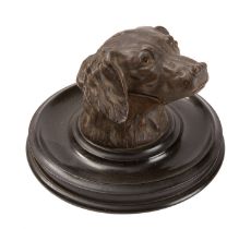 A Continental spelter inkstand cast as a spaniel's head, circa 1900; naturalistically modelled,