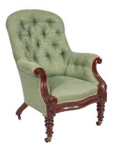 A Victorian walnut and button upholstered armchair,