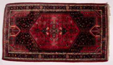 A Hamadan rug, the field with a central rose stepped hexagonal panel,