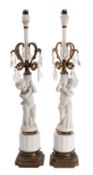 A pair of Victorian bisque porcelain and gilt metal mounted figural table lamps,