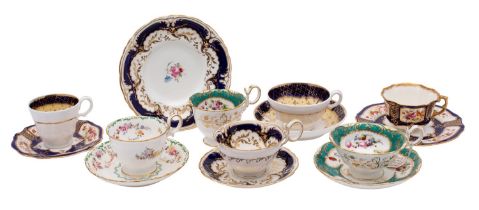 A group of tea wares, comprising a Coalport trio decorated with flowers on a green ground,