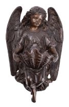 A patinated metal stoup in the form of an angel,