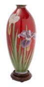 A Japanese cloisonné vase of slender ovoid form, decorated with irises on a foil backed red ground,