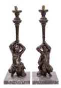 A pair of patinated bronze and marble mounted figural table lamps,