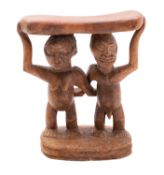 A carved wood headrest, Luba (Baluba) tribe, Zaire,