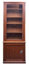 A pitch pine and glazed cabinet bookcase,