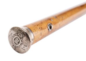 A white metal topped malacca walking stick, 19th century; the pommel engraved AE,