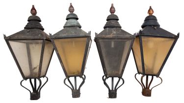 A set of four black-painted copper and acrylic lanterns,