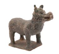 A Chinese terracotta mythical creature in Han Dynasty style standing four square with grey wash