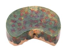 A Chinese sancai-glazed terracotta pillow in Tang Dynasty style of bean shape,