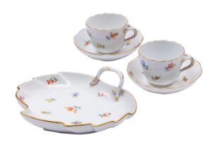 A pair of Meissen cups and saucers and tray, the former of ogee shape,