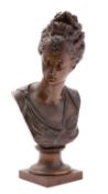 After Jean-Antoine Houdon, (French 1741 - 1828), a patinated bronze bust of a maiden,