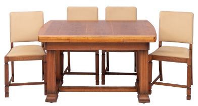 An oak draw leaf dining table and four chairs en suite,