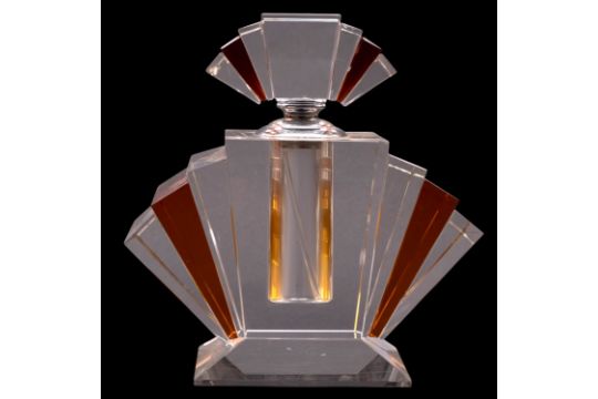 An Art Deco table scent bottle of clear and amber flashed fan-shaped form with chrome mounts, 22.