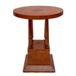 A circular bird's eye maple table, in Art Deco style, of recent manufacture; 76cm high,