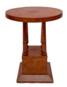 A circular bird's eye maple table, in Art Deco style, of recent manufacture; 76cm high,