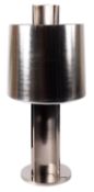 A large brushed steel lamp with cylindrical shade, of recent manufacture,