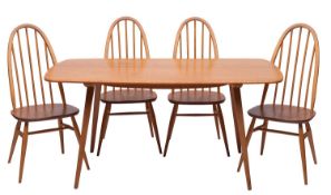 An Ercol blonde elm and beech dining table, and four elm and beech 'Quaker' chairs en suite,