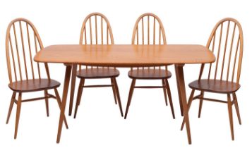 An Ercol blonde elm and beech dining table, and four elm and beech 'Quaker' chairs en suite,