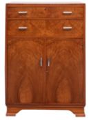 An English Art Deco figured walnut bedroom cabinet,