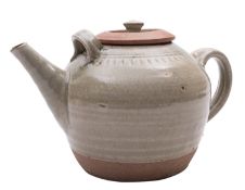 *Richard Batterham [1936 - 2021] a stoneware tea pot under a pale celadon glaze, 32cm long,