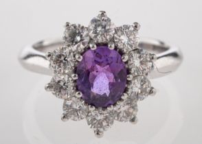 A platinum, purple sapphire and diamond ring,