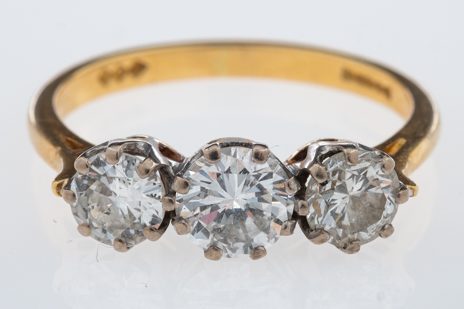 WITHDRAWN A three stone diamond ring, set with brilliant cut diamonds, the centre stone, 0.