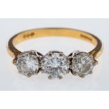 WITHDRAWN A three stone diamond ring, set with brilliant cut diamonds, the centre stone, 0.