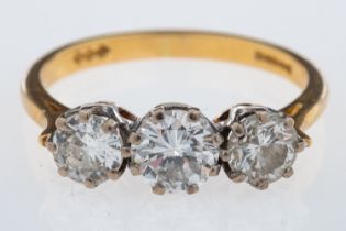 WITHDRAWN A three stone diamond ring, set with brilliant cut diamonds, the centre stone, 0.