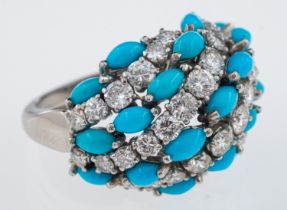A diamond and turquoise bombe form cocktail ring with alternating bands of brilliant cut diamonds
