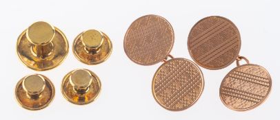 A pair of rose gold cufflinks with engine turned decoration and a set of 9ct gold dress studs, 7.
