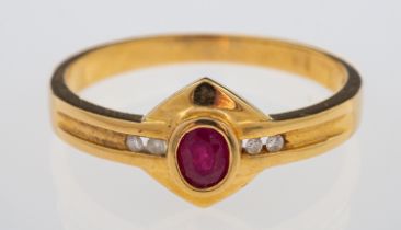 A gold ring set with oval ruby and diamonds on a gold plaque setting,