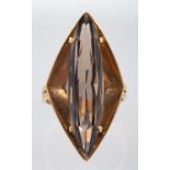 A 1970's dress ring of angular form set with a smoky quartz, ring head size, 3.