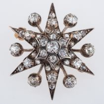A Victorian diamond set star brooch, the six point star and rays set with old cut diamonds,
