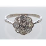 A diamond daisy setting ring, in white gold, estimated total diamond weight, 0.