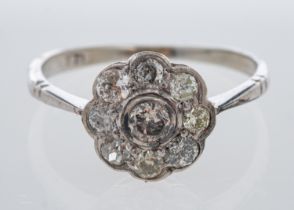 A diamond daisy setting ring, in white gold, estimated total diamond weight, 0.