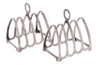 A pair of silver four division toast racks by Henry Clifford Davis, Birmingham 1953,
