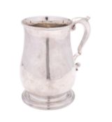 A George II silver tankard, maker's mark rubbed out, London probably 1746, of baluster form,