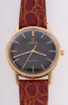 Omega Automatic Genève a gentleman's 18ct gold wristwatch the round black dial with with raised