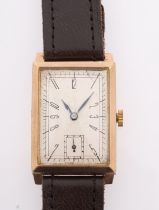 A gentlemen's 9ct gold wristwatch the rectangular dial with stylised black Roman numerals and