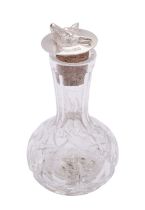 A silver mounted cut glass Angostura bitters bottle by Barker Ellis Silver Co.