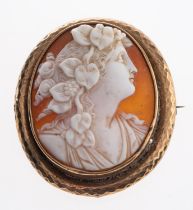 A late Victorian shell cameo brooch, circa 1890, the oval shell panel carved with Flora, 4.