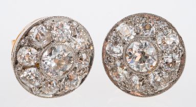 An Edwardian diamond set earrings, set with old cut stones in a millgrain setting,