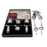 A silver six piece cruet set by Roberts & Dore Ltd, Birmingham 1936, round faceted,