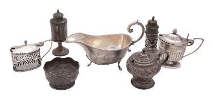 A collection of silver condiments, to include: a mustard pot by Hilliard & Thomason,