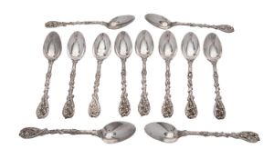 An unusual set of twelve Victorian Scottish silver cast handled teaspoons by A. G.