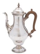 A silver small coffee pot by The Goldsmiths & Silversmiths Co.