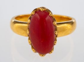 A vintage hand crafted ring set with cabochon form coral, in high carat gold,